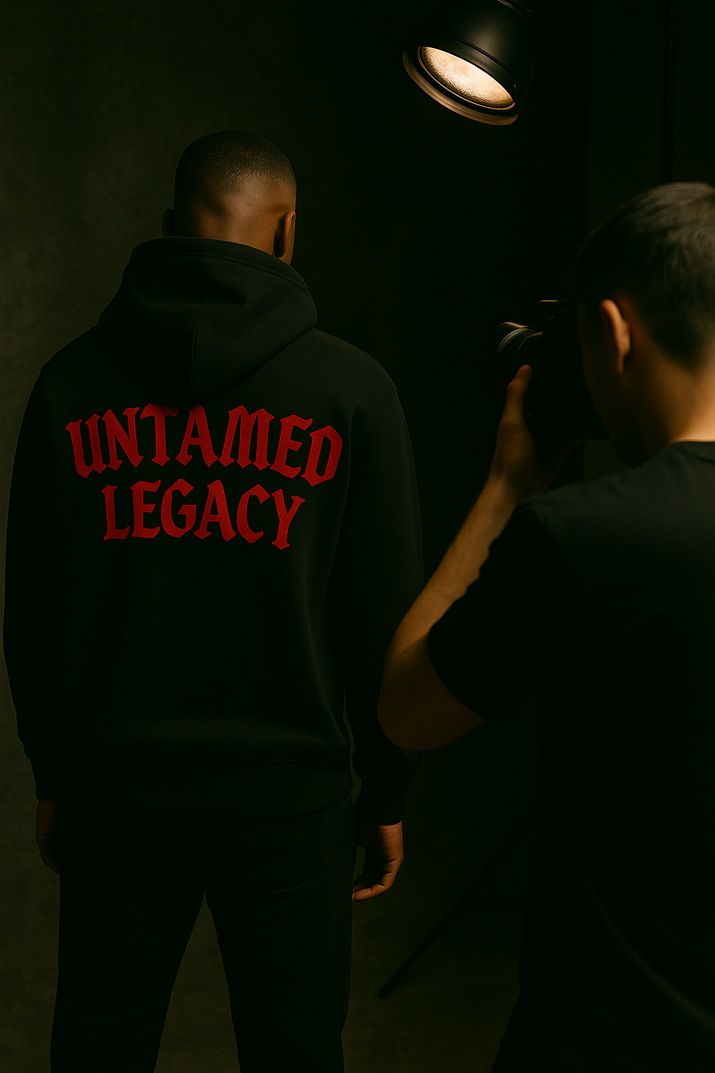 Black model posing for Untamed Legacy look book shoot — capturing the essence of raw, editorial-style urban fashion photography.
