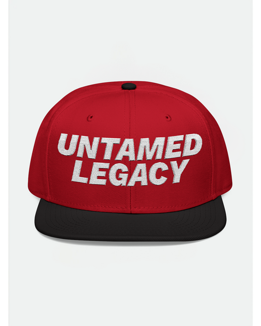 Bold red and black snapback hat with white embroidered “Untamed Legacy” logo, designed for standout streetwear styling.